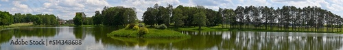 Panoramic photo lake, forest in summer. Bright sunny day.