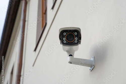 Modern smart outdoor cctv camera with night vision on house, protecting property against burglars and robbers
