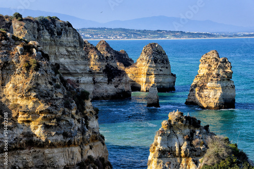 Europe, Portugal, Southern Portugal , Algarve region , Faro district , Lagos, panoramic view of Atlantic coast from cliffs of Ponta da Piedade, Meia Praia in far background