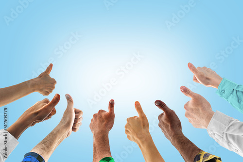 Hands with thumbs up. Concept of successful teamwork, or public approval. Like thumb ok symbol, yes, okay, good, well, fine, nicely