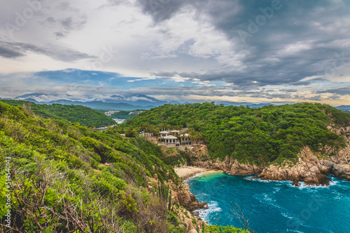 Huatulco bays - "La Entrega" beach. Beautiful beach with pristine waters, with turtles and fishes. Mexican beach with wooden huts by the sea