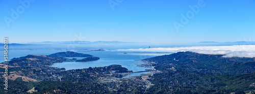 Panoramic view of San Francisco Bay from Mount Tamalpais with scenic dense fog covering Pacific Ocean and city of San Francisco