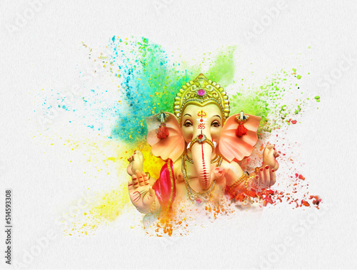 Lord Ganesha, is one of the best-known and most worshiped god in the Hindu religion lord Ganesha of Indian festival tradition Explosion of colored powder on white background