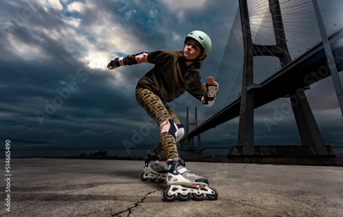 Roller skating teen in outdoors rollerblading on inline skates. Caucasian young girl in outdoor activities.