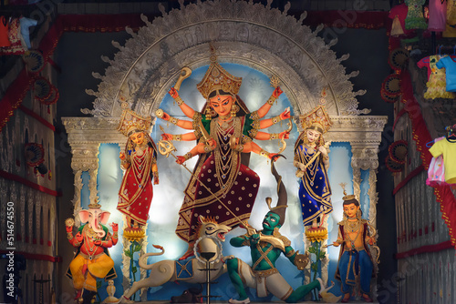 Idol of Goddess Devi Durga at a decorated puja pandal in Kolkata, West Bengal, India. Durga Puja is a famous and major religious festival of Hinduism that is celebrated throughout the world.