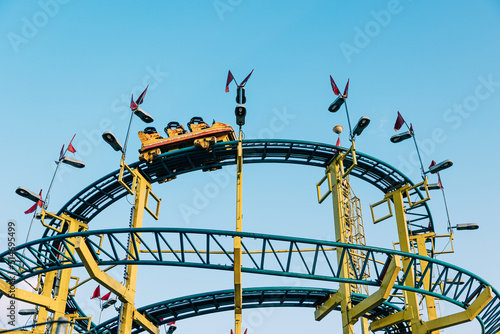 Close-up view of a roller coaster ride in an amusement park. Entertainment and fun concept.