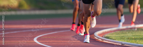 Athletics people running on the track field.Running a race on a track for sports competition and winning