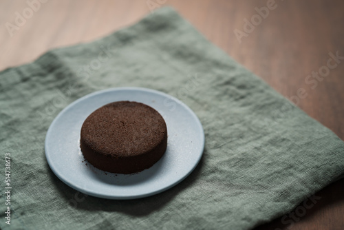 Used coffee puck on a saucer