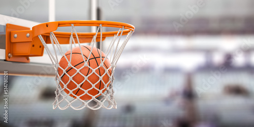 Basketball ball scoring the winning points on basketball net hoop on basketball arena. 3d illustration
