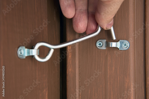 Security hook and eye door lock for doors locking of country house.