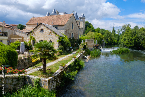 sunny riverside view of Verteuil-sur-Charente, Charente, France