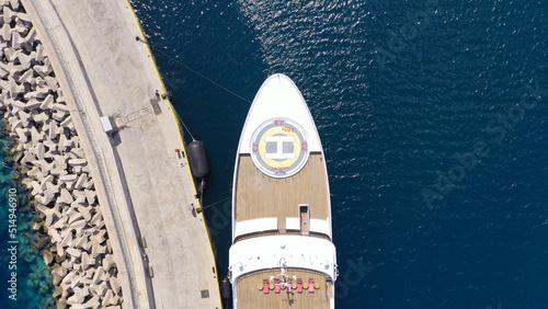 Aerial drone photo of luxury yacht anchored in mediterranean port