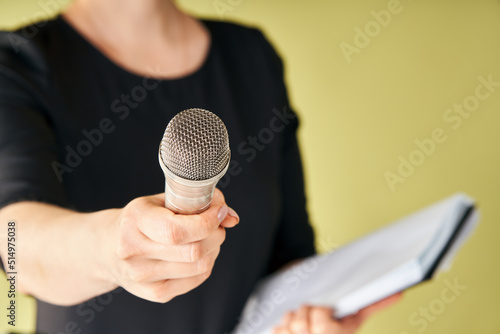 Journalist with microphone interviewing you