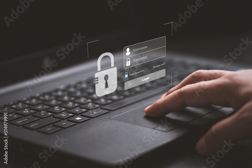 Hand typing on keyboard laptop computer to input username and password for or technology security system and prevent hacker concept.