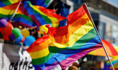 Lgbt pride rainbow flag during parade in the city .