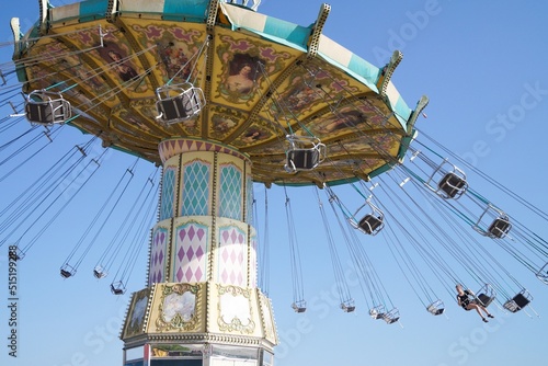 Volgograd, Russian Federation, June 19, 2022 - Swing carousel in an amusement park on the Volga River embankment. 