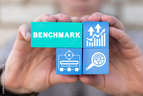 Concept of benchmark indicators improvement and achievement. Idea of business development and improvement. Compare quality with competitor companies. Benchmarking concept.