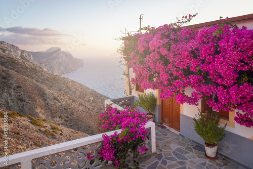 House with flowers at greek mountain village at sunset, Olympos, Greek Islands