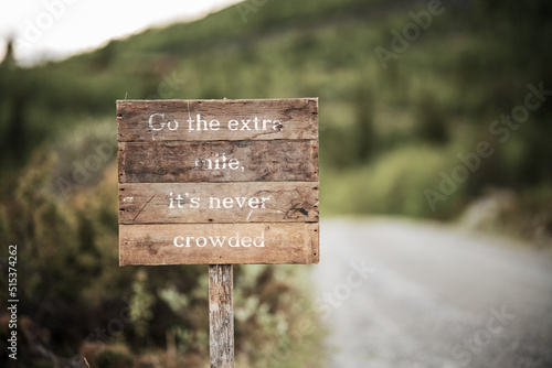 go the extra mile its never crowded roadsign
