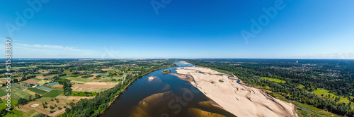 Low water level in Vistula river, effect of drought seen from the bird's eye perspective. City Warsaw in a distance.
