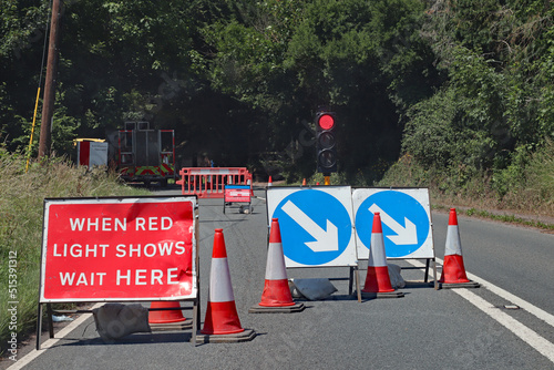 Waiting at a red light at roadworks controlled by traffic lights in Somerset, England. No traffic is approaching from the opposite direction