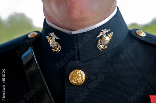 Closeup of a groom's marine corps uniform symbols dressed on his wedding day