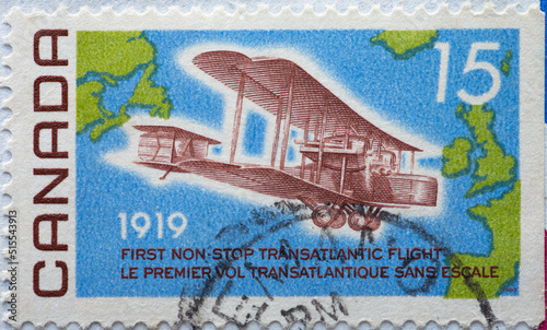 CANADA - CIRCA 1969: a postage stamp from CANADA , showing a historic biplane aircraft 50th Anniversary of First Non-stop Transatlantic Flight . About 1969.