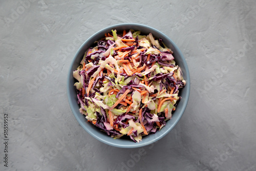 Homemade Coleslaw with Cabbage and Carrots in a Bowl, top view. Flat lay, overhead, from above.