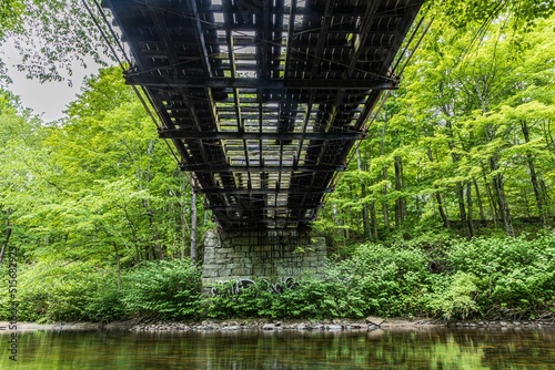 Low angle shot of a beautiful bridge constructed above the water in Lancaster, MA, USA