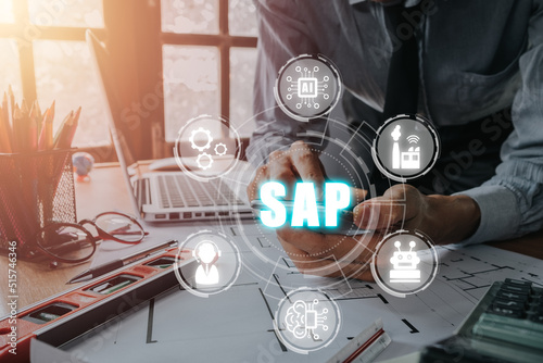 SAP - Business process automation software and management software (SAP), Person hand using smart phone with SAP icon on VR screen, ERP enterprise resources planning system concept on virtual screen.