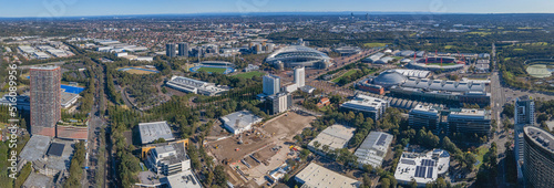 Panoramic aerial drone view of Sydney Olympic Park, an Inner West suburb of Sydney, NSW, Australia on a sunny day 