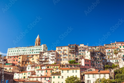 Conglomeration of old vintage colorful houses named borgo on a hilltop of Ventimiglia in Liguria, Italy