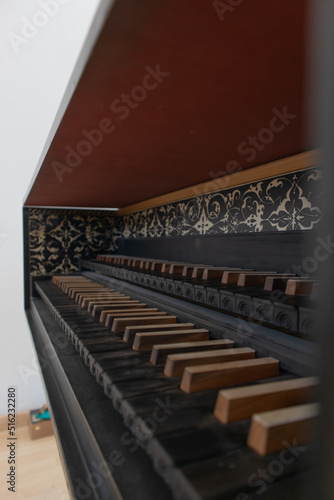 baroque style harpishcord, old renaissance classic piano with black wooden keys