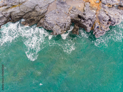 Aerial view seashore wave on rocky cliff