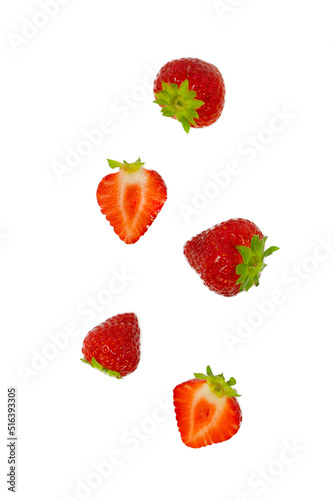Isolated strawberries. Falling strawberry fruits whole and cut in half isolated on white background 
