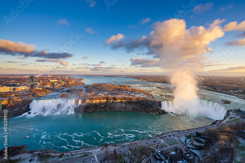 Overlooking the Niagara Falls ( American Falls and Horseshoe Falls ) in sunset time.