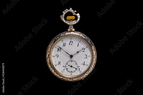 Silver mechanical antique pocket watch on black isolated background. Retro pocketwatch with second, minute and hour hand. Old round clock with dial for gentleman. Vintage timepiece.