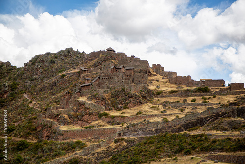 Woman entering Inca ruins at Pisac in the Sacred Valley in Cusco, Peru