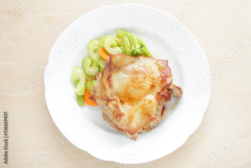 Homemade grilled chicken tight meat served with celery and carrot