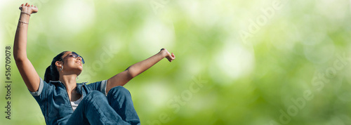 relaxed girl breathing calmly in the open air with her arms raised