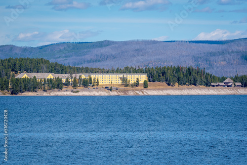 View of National Historic Landmark Lake Yellowstone Hotel, Lake Yellowstone in foreground and mountains in background