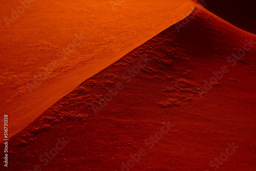 Abstract alien photo. Dune on the red planet. Background in red key. Red sand, abstract sand dune in desert.