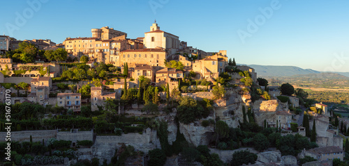 Gordes, panoramic view of one of the most well-known hilltop villages of Provence at sunset. Unique architecture of stone houses and terraces in Vaucluse, Provence-Alpes-Cote d'Azur region, France