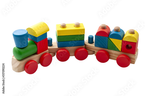 Vintage toy train model made of blocks in many shapes isolated on white background with a clipping path cutout concept for childhood development, minimalist nostalgic toys and educational play time