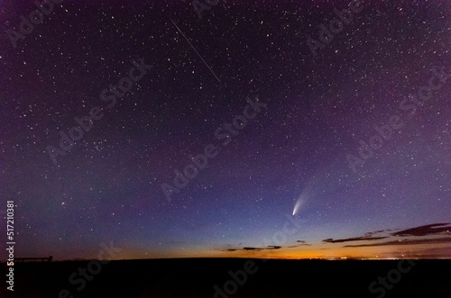 Breathtaking view of Neowise comet in blue starry sky from Great Falls, Montana
