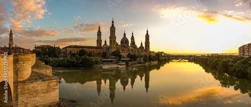 Panoramic view of The Cathedral-Basilica of Our Lady of the Pillar with evening lights, Roman Catholic church in the city of Zaragoza, Aragon 