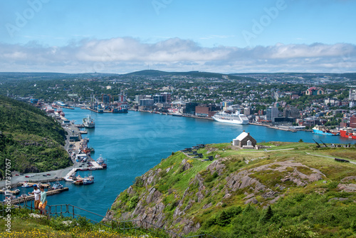 A view of St. John's harbour in Newfoundland, taken from atop Signal Hill, with the Queen's Battery in the foreground.