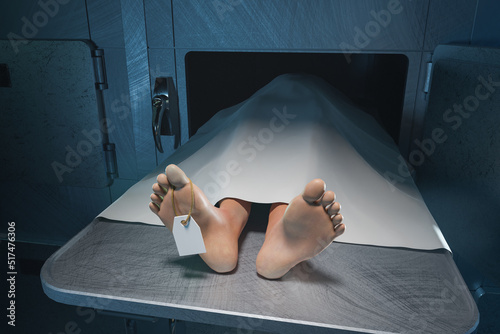 The feet of a deceased person stick out from under the sheet in the hospital morgue