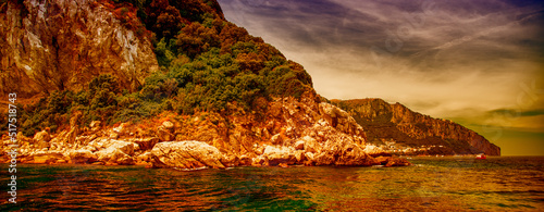 Beautiful view of Capri coastline from the sea in summer season, Italy