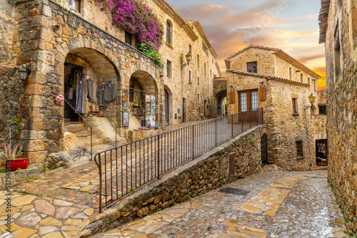 The medieval Spanish village of Pals in the Costa Brava region of Southern Spain as the sun sets after a summer rainstorm.